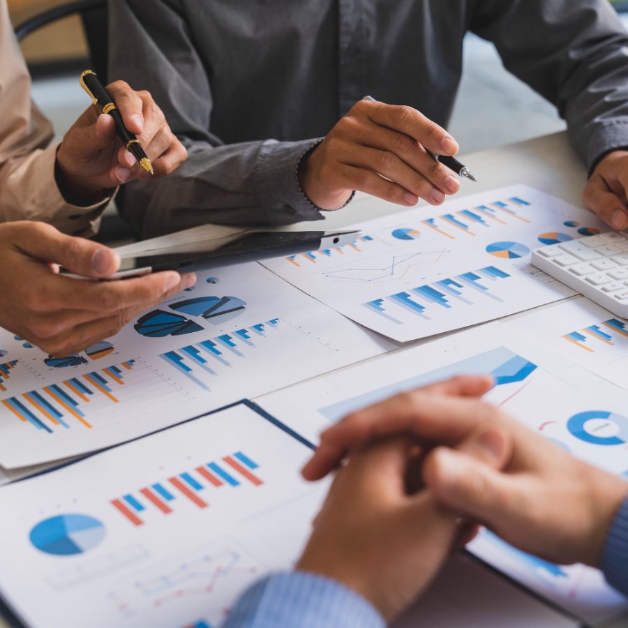 Two professionals reviewing performance charts